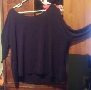 An off the shoulder black dress shirt